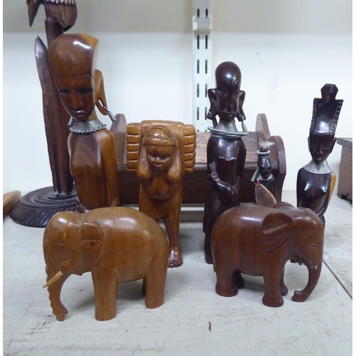 168 - Wooden items: to include carved animals; and a book trough  6