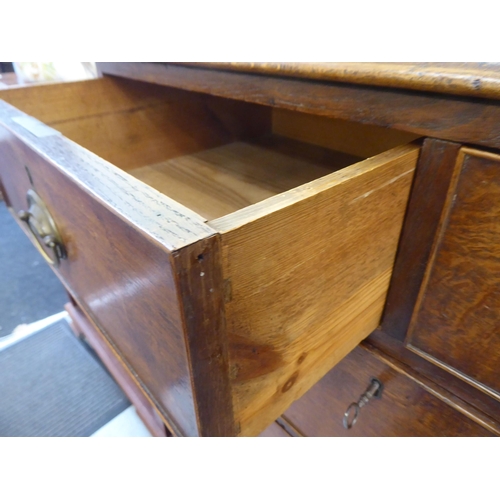 176 - A 19thC oak dressing chest with two short/three graduated long drawers and brass bail handles, raise... 