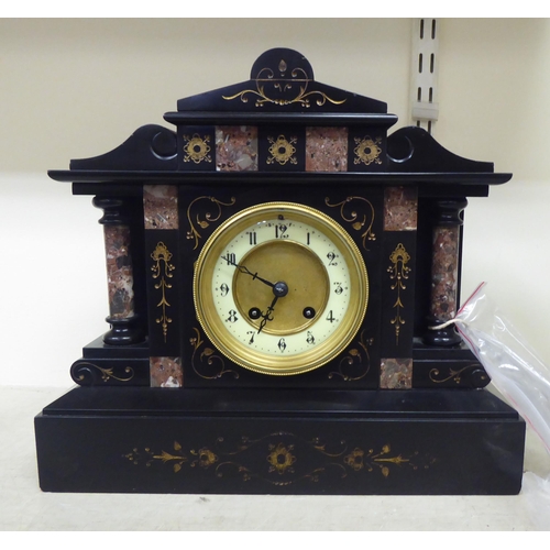 191 - A late Victorian slate and marble cased mantel clock of architectural form; the movement faced by an... 