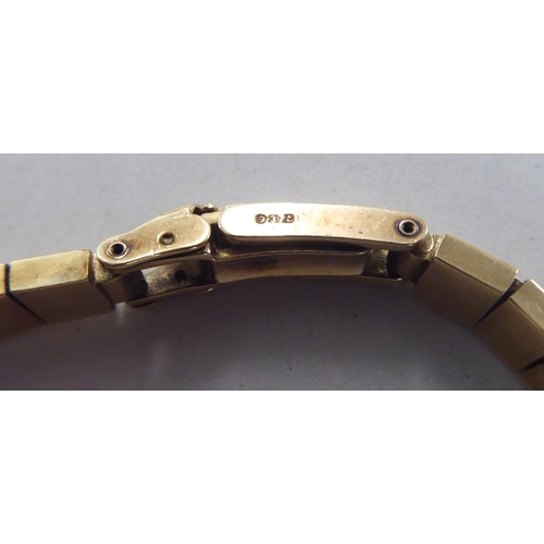 199 - A ladies Omega 9ct gold cased bracelet wristwatch, faced by a baton dial