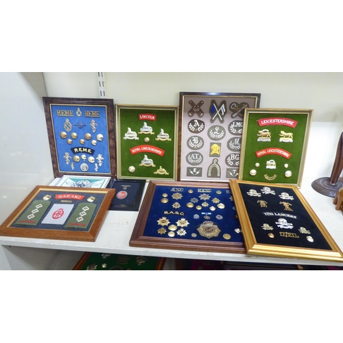 202 - A varied and eclectic collection of British uniform badges and associated emblems, some copies: to i... 