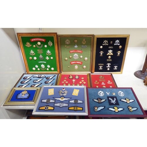 202 - A varied and eclectic collection of British uniform badges and associated emblems, some copies: to i... 