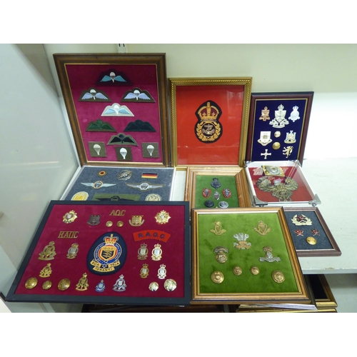 202 - A varied and eclectic collection of British uniform badges and associated emblems, some copies: to i... 