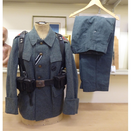 211 - A World War II design German military uniform, on a manikin  34