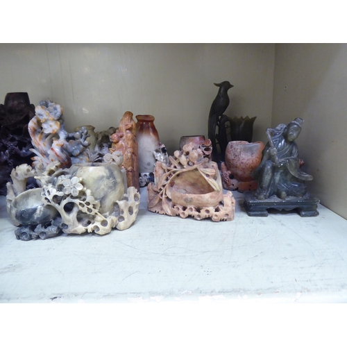 213 - 20thC carved Oriental soapstone ornaments: to include landscapes, birds and vases  mixed sizes