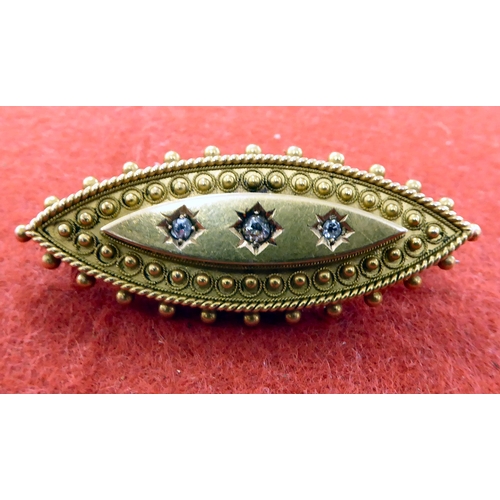 219 - A late Victorian yellow metal mourning brooch, set with three diamonds