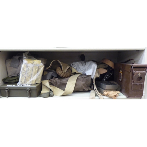 230 - Military related items: to include a first aid box; an ammunition carrier and a gas mask holder ... 