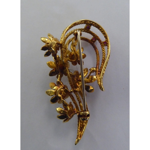 232 - A yellow metal floral spray design brooch, set with diamonds and rubies