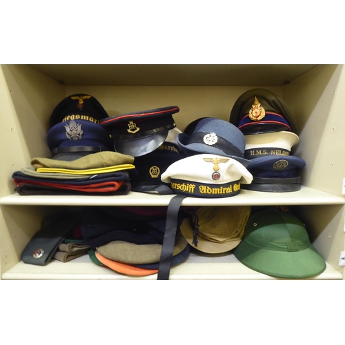 243 - Military and other, mainly 20thC headgear: to include peaked caps, berets and side caps(Please Note:... 