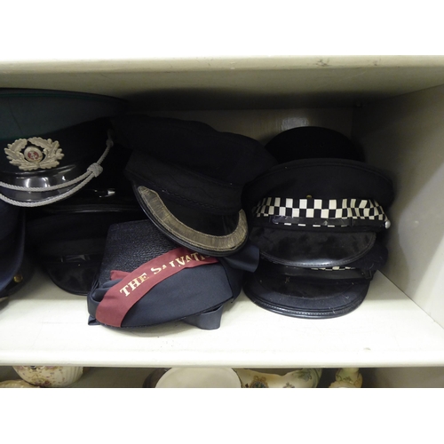 244 - Military and other, mainly 20thC headgear: to include peaked caps(Please Note: this lot is subject t... 