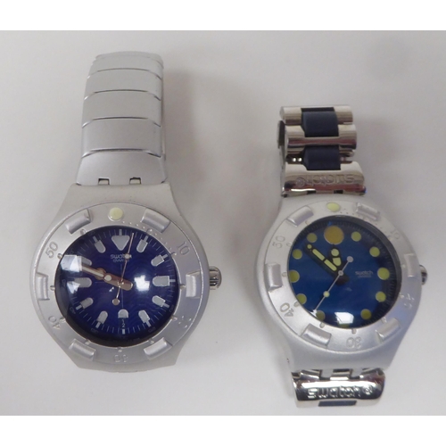 246 - Two Swatch Scuba 200 Irony bracelet wristwatches, each faced by a baton dial