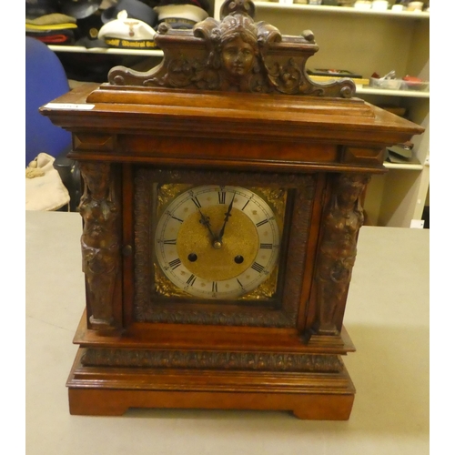 254 - An early 20thC (possibly German), mahogany cased mantel clock; the movement faced by a steel Roman d... 