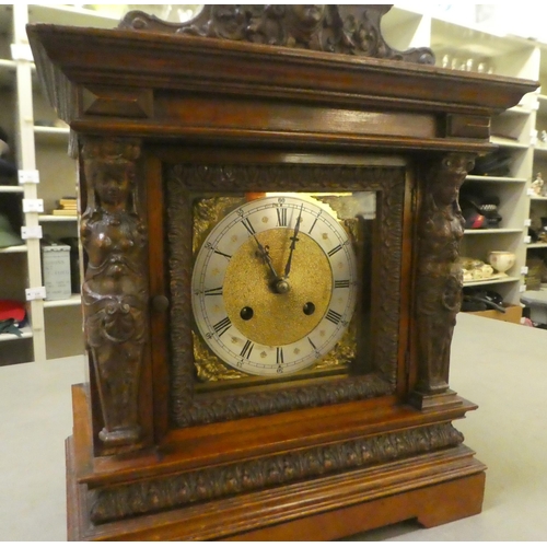 254 - An early 20thC (possibly German), mahogany cased mantel clock; the movement faced by a steel Roman d... 