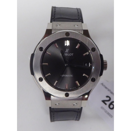 261 - A Hublot Fusion Racing Grey titanium cased wristwatch, the automatic movement faced by a baton dial,... 