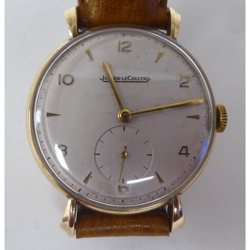 266 - A Jaeger Le Coultre (P469/1C) 9ct gold cased wristwatch, faced by an Arabic and baton dial, incorpor... 