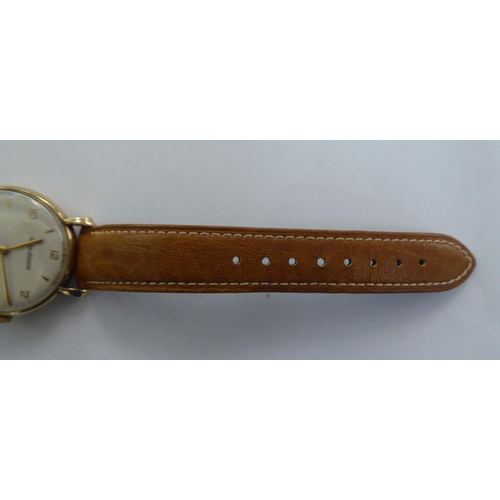 266 - A Jaeger Le Coultre (P469/1C) 9ct gold cased wristwatch, faced by an Arabic and baton dial, incorpor... 