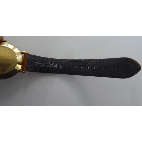 266 - A Jaeger Le Coultre (P469/1C) 9ct gold cased wristwatch, faced by an Arabic and baton dial, incorpor... 