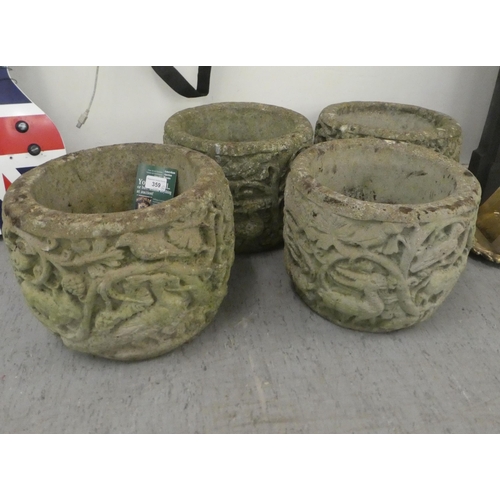 359 - A set of four composition stone planters, decorated with a forest scene  10