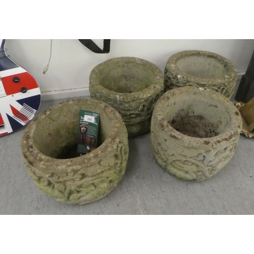 359 - A set of four composition stone planters, decorated with a forest scene  10