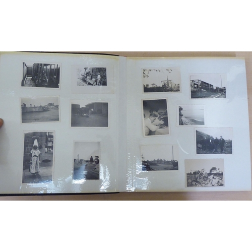 367 - Two albums of mainly 20thC monochrome photographs: to include military, academic, sport and period F... 