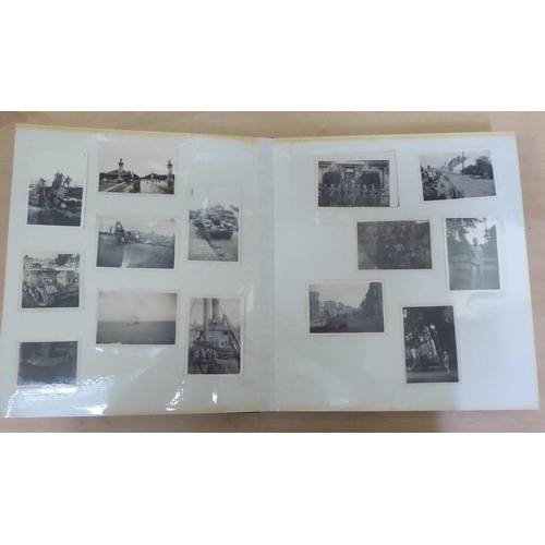 367 - Two albums of mainly 20thC monochrome photographs: to include military, academic, sport and period F... 