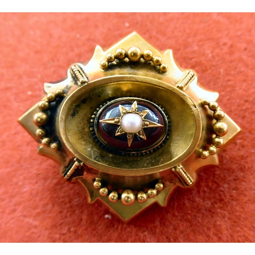 371 - A late Victorian yellow metal garnet and pearl set brooch