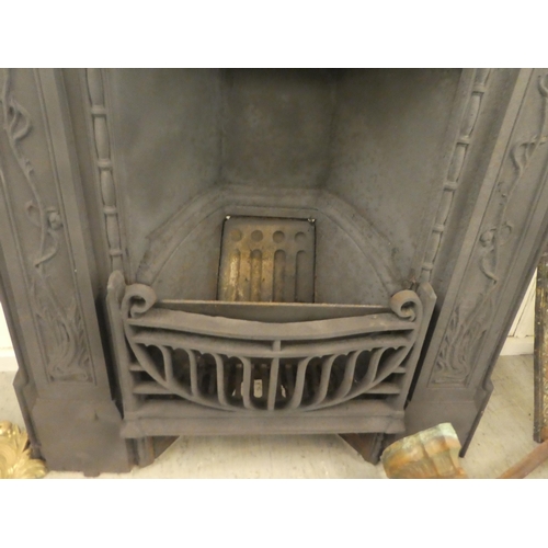 374 - An early 20thC cast iron fire surround and back, decorated in relief with flora  41