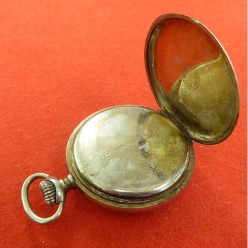 376 - A military issue Zennith base metal cased pocket watch, faced by an Arabic dial with subsidiary seco... 