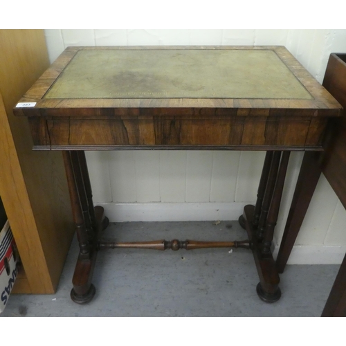 383 - A William IV rosewood writing table with a frieze drawer, raised on three turned pillars, on a plint... 