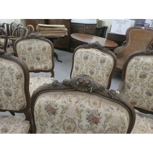 384 - A set of six early to mid 20thC French inspired mahogany framed showwood chairs, upholstered with fl... 