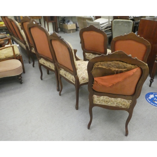 384 - A set of six early to mid 20thC French inspired mahogany framed showwood chairs, upholstered with fl... 