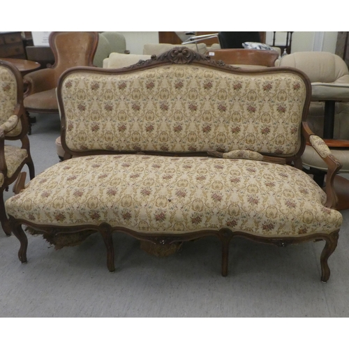 385 - An early to mid 20thC French inspired mahogany framed showwood two person open arm settee, upholster... 