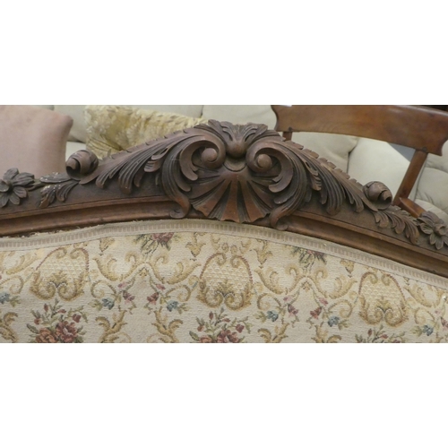 385 - An early to mid 20thC French inspired mahogany framed showwood two person open arm settee, upholster... 