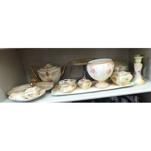 389 - Late Victorian Crown Devon china tableware, decorated with flora