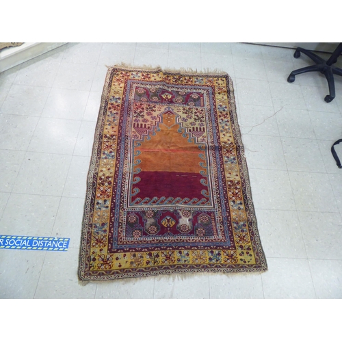 393 - Rugs: to include a Persian runner, decorated with repeating diamond formation and stylised designs&n... 