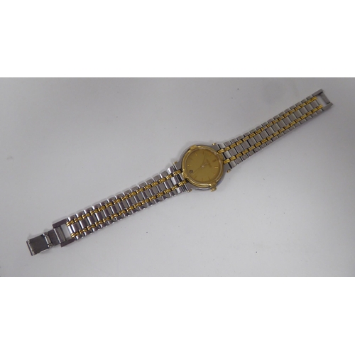 395 - A lady's Gucci 900L  bi-coloured stainless steel cased  bracelet wristwatch, faced by a gilded baton... 