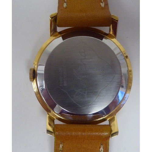 400 - A Delbana gold plated stainless steel, gold plated cased 17 jewel wristwatch, faced by a gilded Arab... 