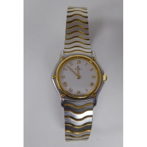 406 - A lady's Ebel 1911 bi-coloured stainless steel cased bracelet wristwatch, faced by a Roman dial