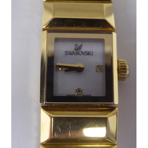 412 - A lady's Swarovski Baguette gilded stainless steel cased, quartz bracelet wristwatch  boxed