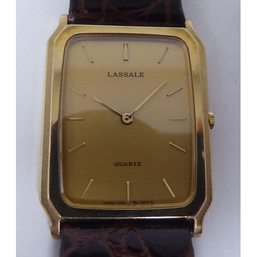 413 - A Seiko Lassale gold plated and stainless steel cased wristwatch, faced by a gilded baton dial, on a... 