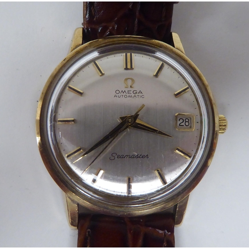 428 - A 1960s Omega Seamaster 552 calibre 14ct gold cased wristwatch, the automatic movement faced by a si... 