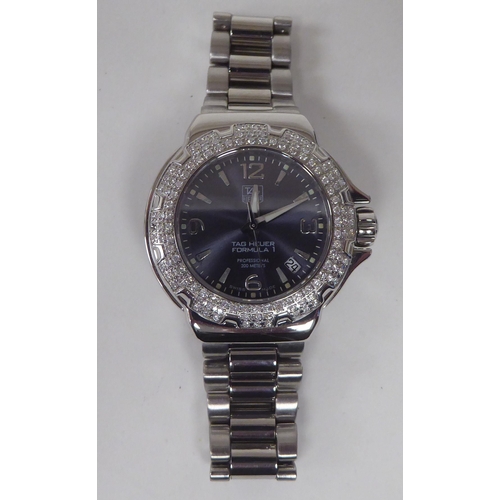 430 - A lady's Tag Heuer Fomula 1 diamond encrusted quartz stainless steel cased bracelet wristwatch, face... 