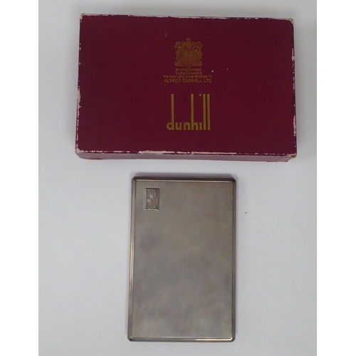 436 - A Dunhill silver folding cigarette case with engine turned decoration and a sliding clasp  Lond... 