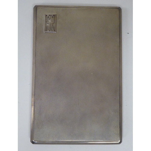 436 - A Dunhill silver folding cigarette case with engine turned decoration and a sliding clasp  Lond... 