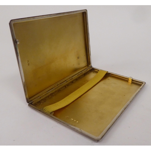 436 - A Dunhill silver folding cigarette case with engine turned decoration and a sliding clasp  Lond... 