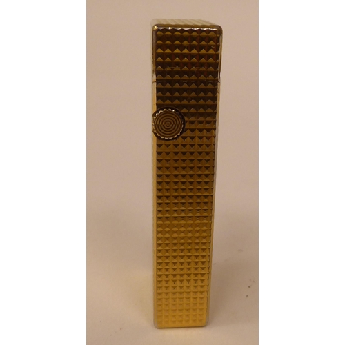 438 - Two similar Dunhill textured gold plated cased flip-top, gas filled cigarette lighters  one box... 