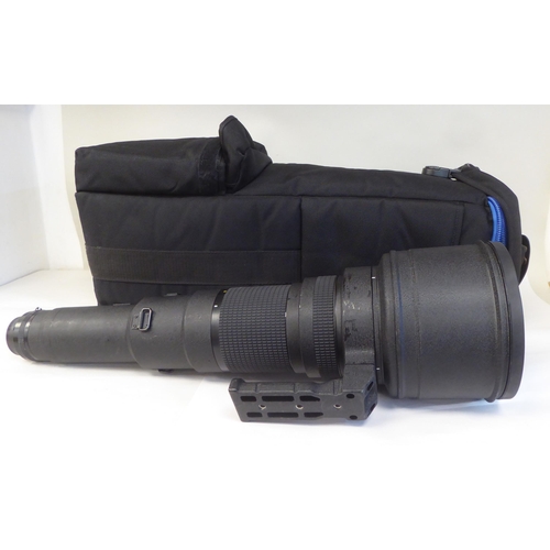 77 - A Nikon Nikkor 800mm 1:5.6 photographic lens, in a padded bag