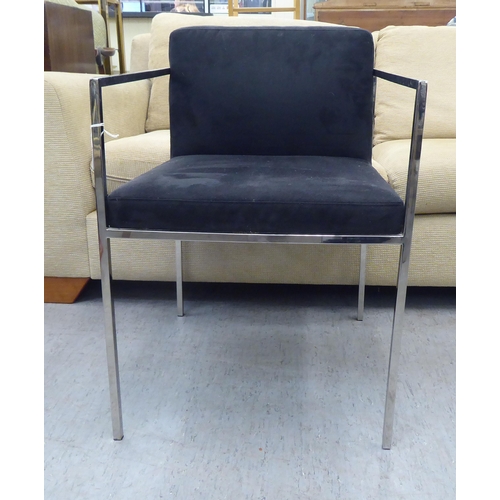 79 - A Kesterport chromium plated framed open arm desk chair, raised on square legs