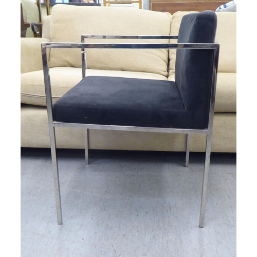 79 - A Kesterport chromium plated framed open arm desk chair, raised on square legs