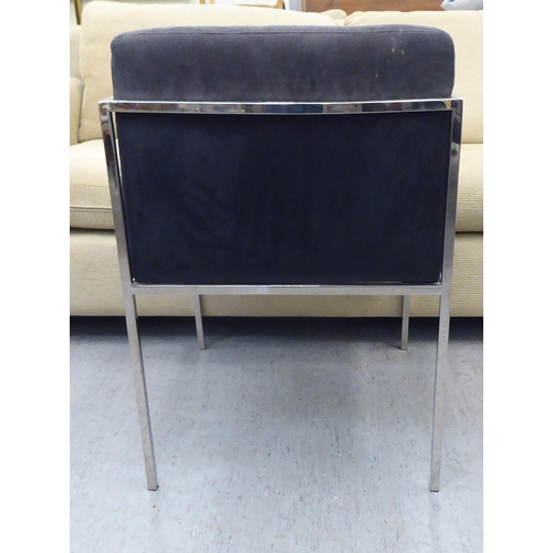 79 - A Kesterport chromium plated framed open arm desk chair, raised on square legs